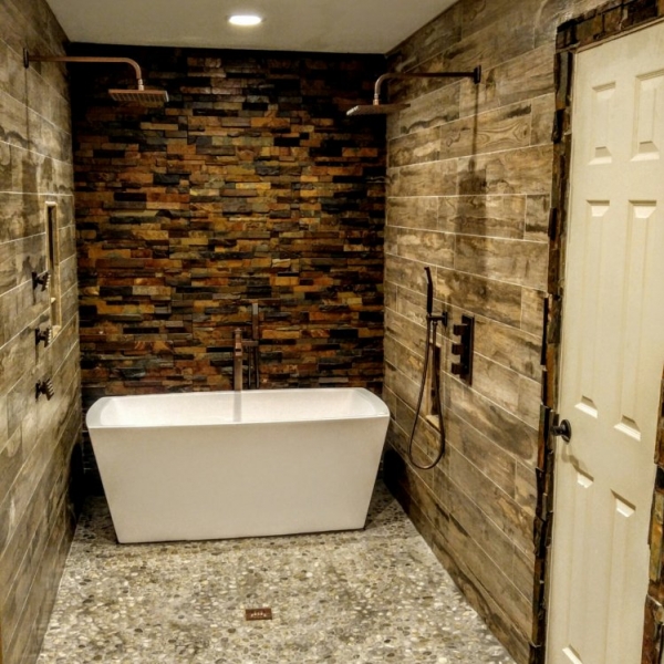 Rustic Bathroom with wood-look porcelain, pebbles, and slate stacked stone
