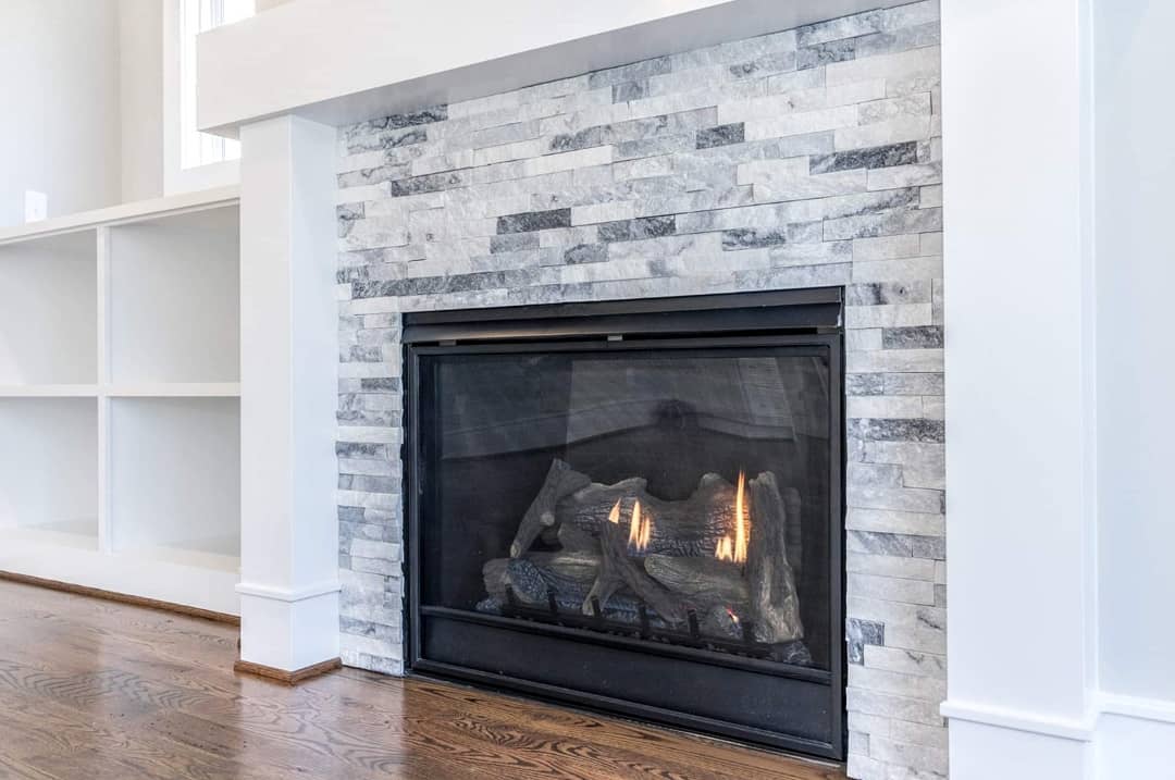 white stacked stone fireplace